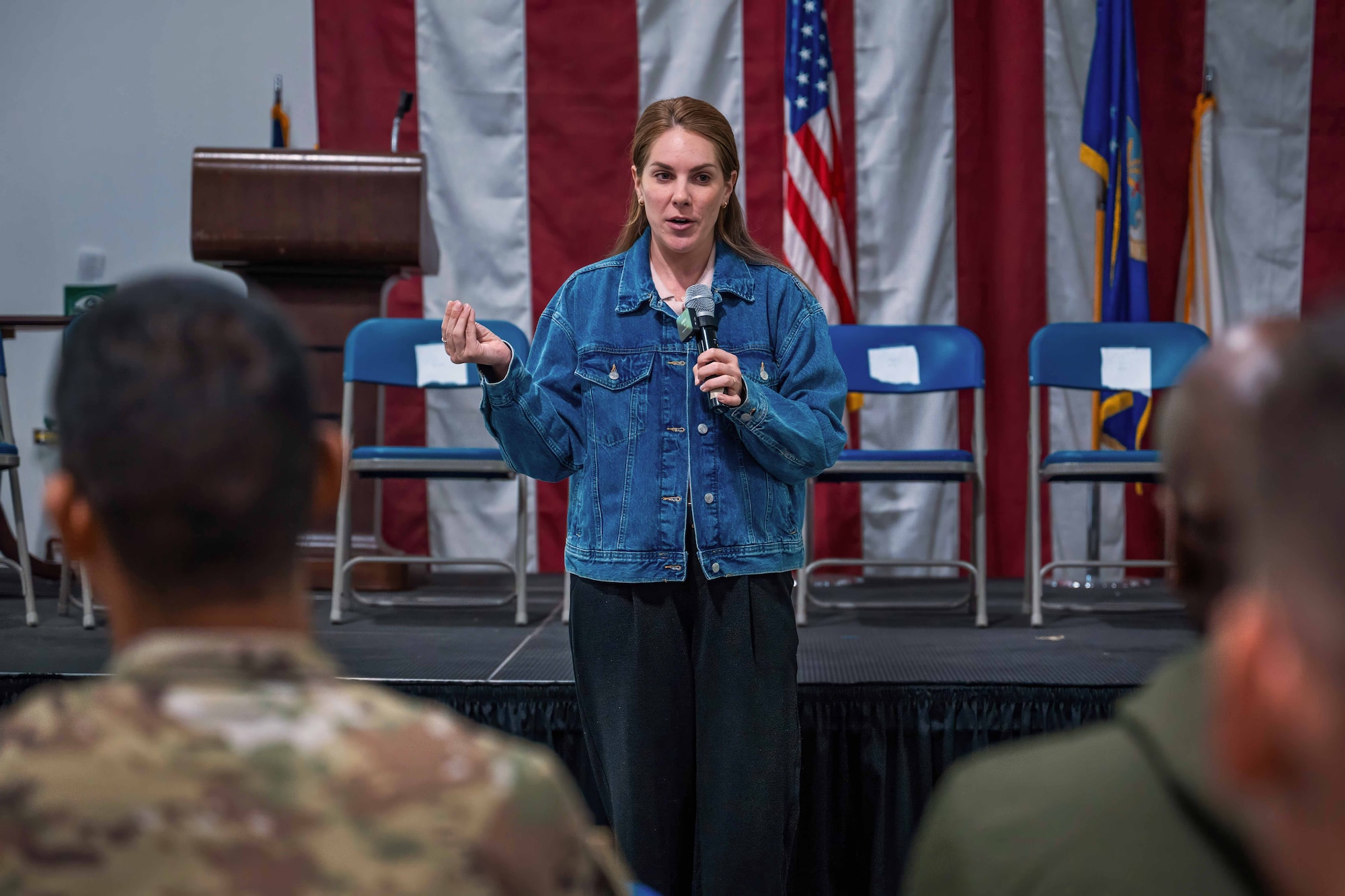 Woman speaks to crowd.
