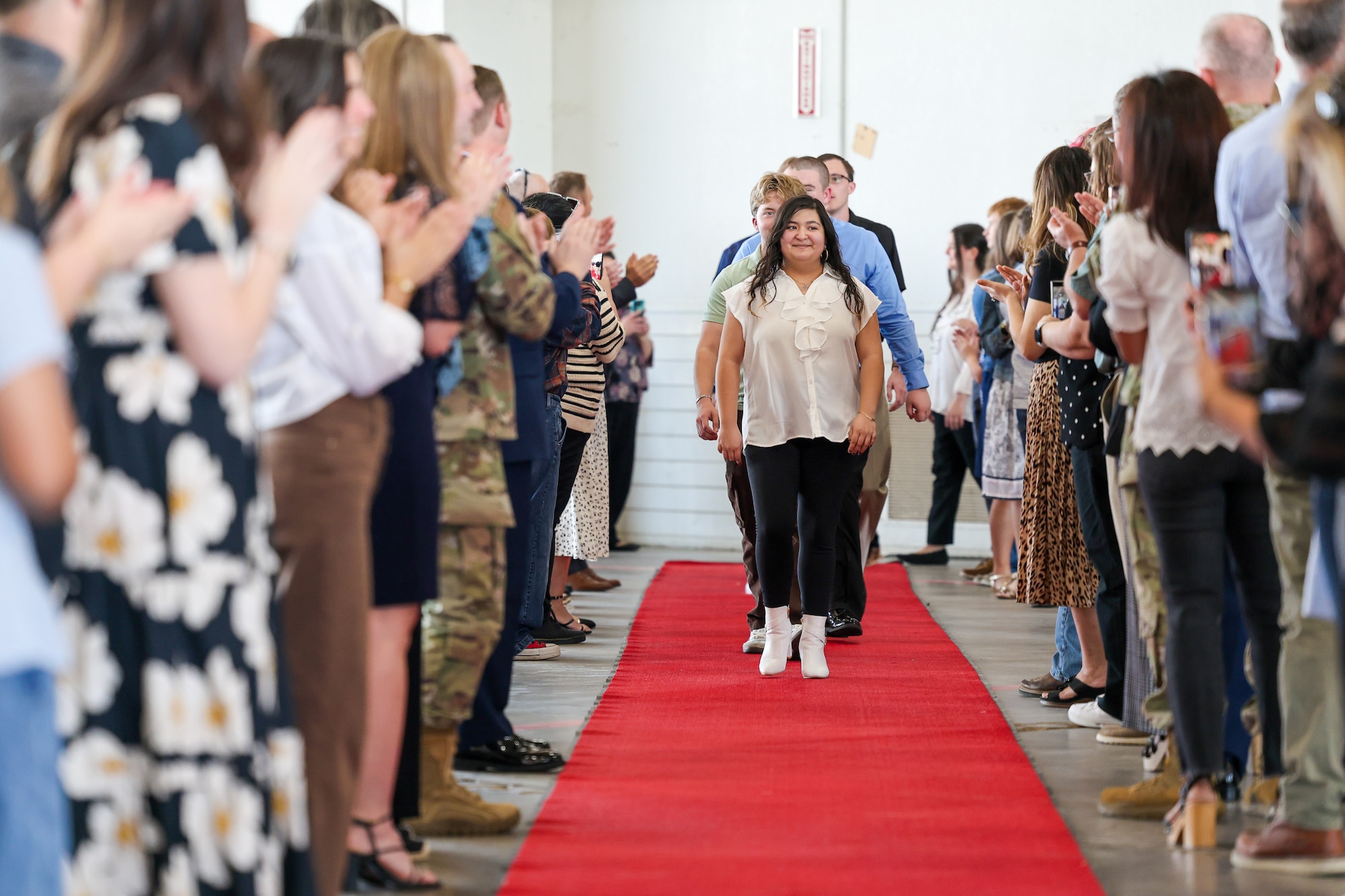 Local high school seniors walk a red carpet as they enter the inaugural Military-Connected Senior Recognition Ceremony at Sheppard Air Force Base, Texas, March 29, 2026.