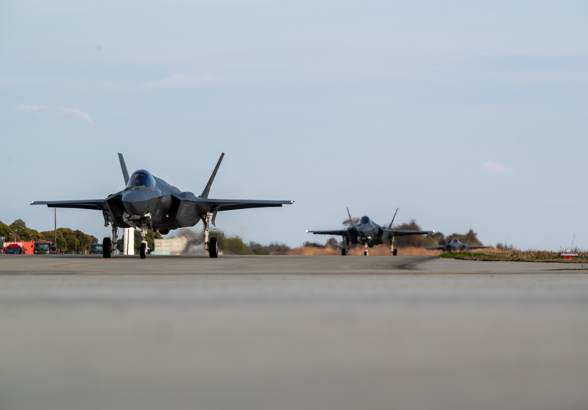 U.S. Air Force F-35A Lightning IIs assigned to the 4th Expeditionary Fighter Squadron, deployed to Kadena Air Base, taxi after landing at Japan Air Self-Defense Force Nyutabaru Air Base, Japan.