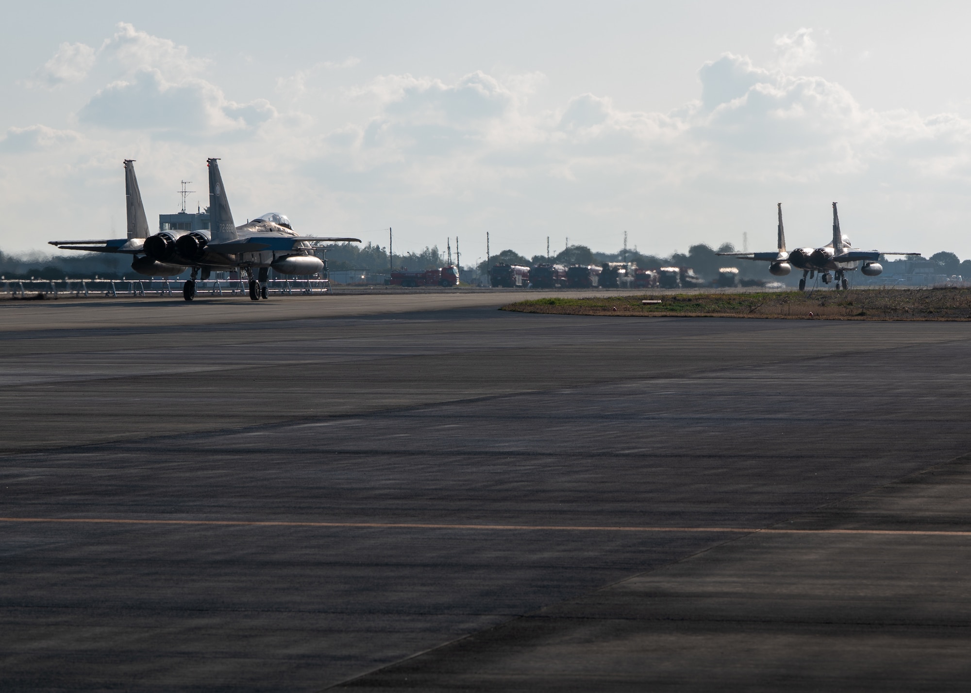Japan Air Self-Defense Force F-15J Eagles assigned to the 305th Tactical Fighter Squadron taxi down the flightline during Nyutabaru Aviation Training Relocation exercise 26-1, at JASDF Nyutabaru Air Base, Japan.