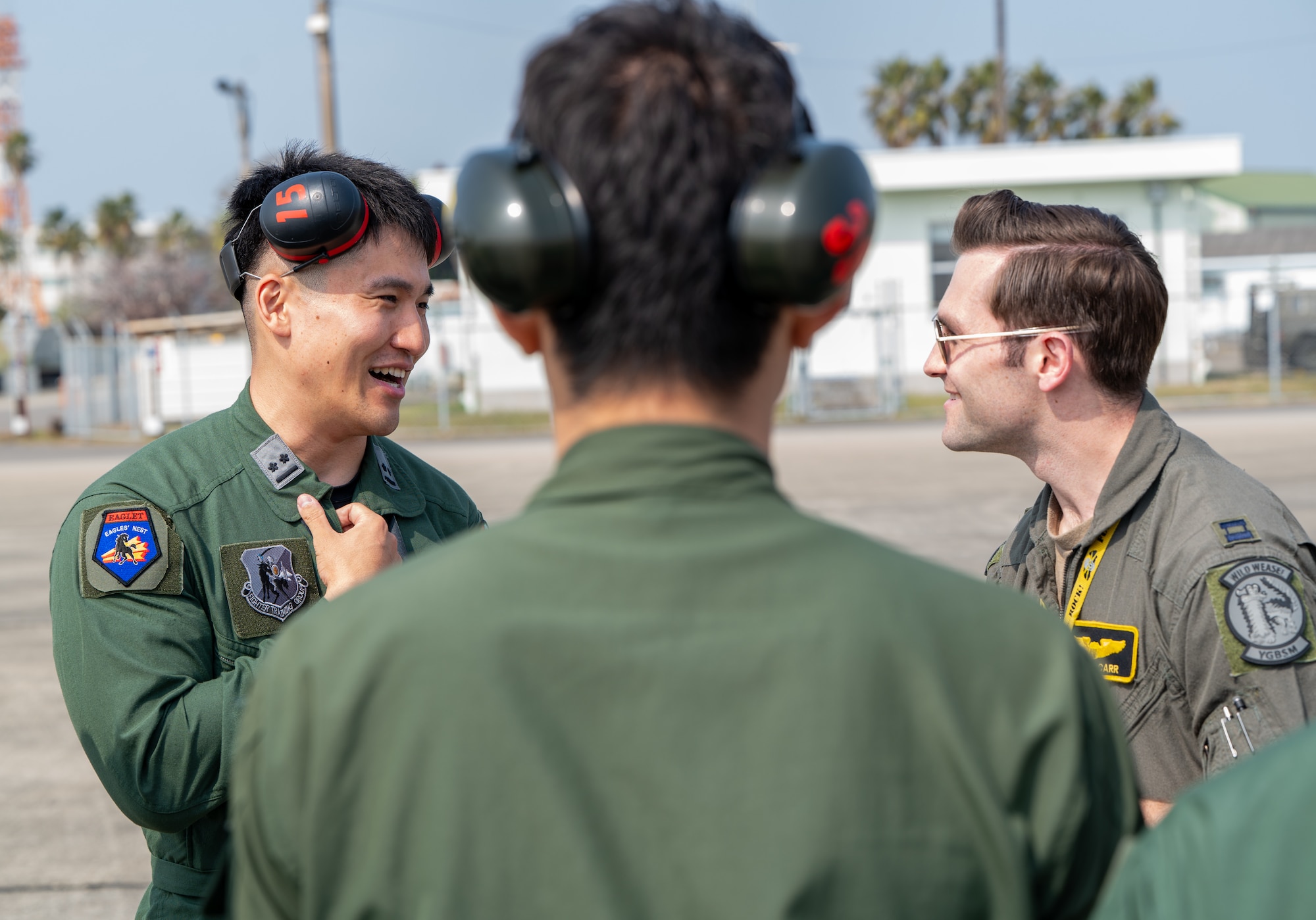 U.S. Air Force Capt. William Carr, right, 4th Expeditionary Fighter Squadron F-35A Lightning II pilot, converses with a Japan Air Self-Defense Force pilot during Nyutabaru Aviation Training Relocation exercise 26-1, at JASDF Nyutabaru Air Base, Japan.