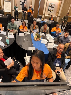 Participants conduct a tabletop exercise simulating a crisis resulting in mass cross border displacement of people during a civil-military crisis response workshop in Clark Freeport and Economic Zone, Philippines, March 26, 2026