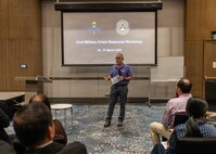Michael Wylie, an advisor with the Center for Excellence in Disaster Engagement and Humanitarian Assistance, gives remarks during a civil-military crisis response workshop in Clark Freeport and Economic Zone, Philippines, March 25, 2026.