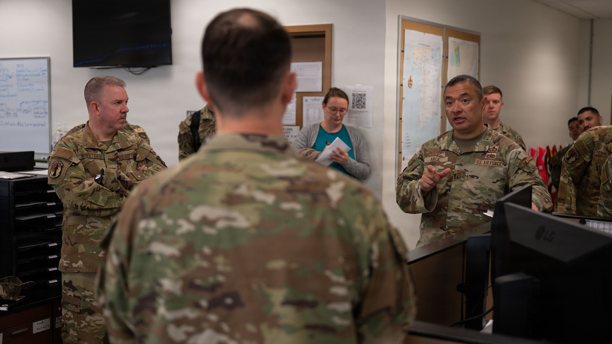 U.S. Air Force Chief Master Sgt. Joseph Arce, right, Eighteenth Air Force command chief, speaks to Master Sgt. Kaleb Hamrac, 731st Air Mobility Squadron personnel programs manager, during a brief at Osan Air Base, Republic of Korea, April 1, 2026. The visit provided an opportunity to assess ongoing operations and reinforce priorities supporting the Fight Tonight mission. (U.S. Air Force photo by Senior Airman Rome Bowermaster)