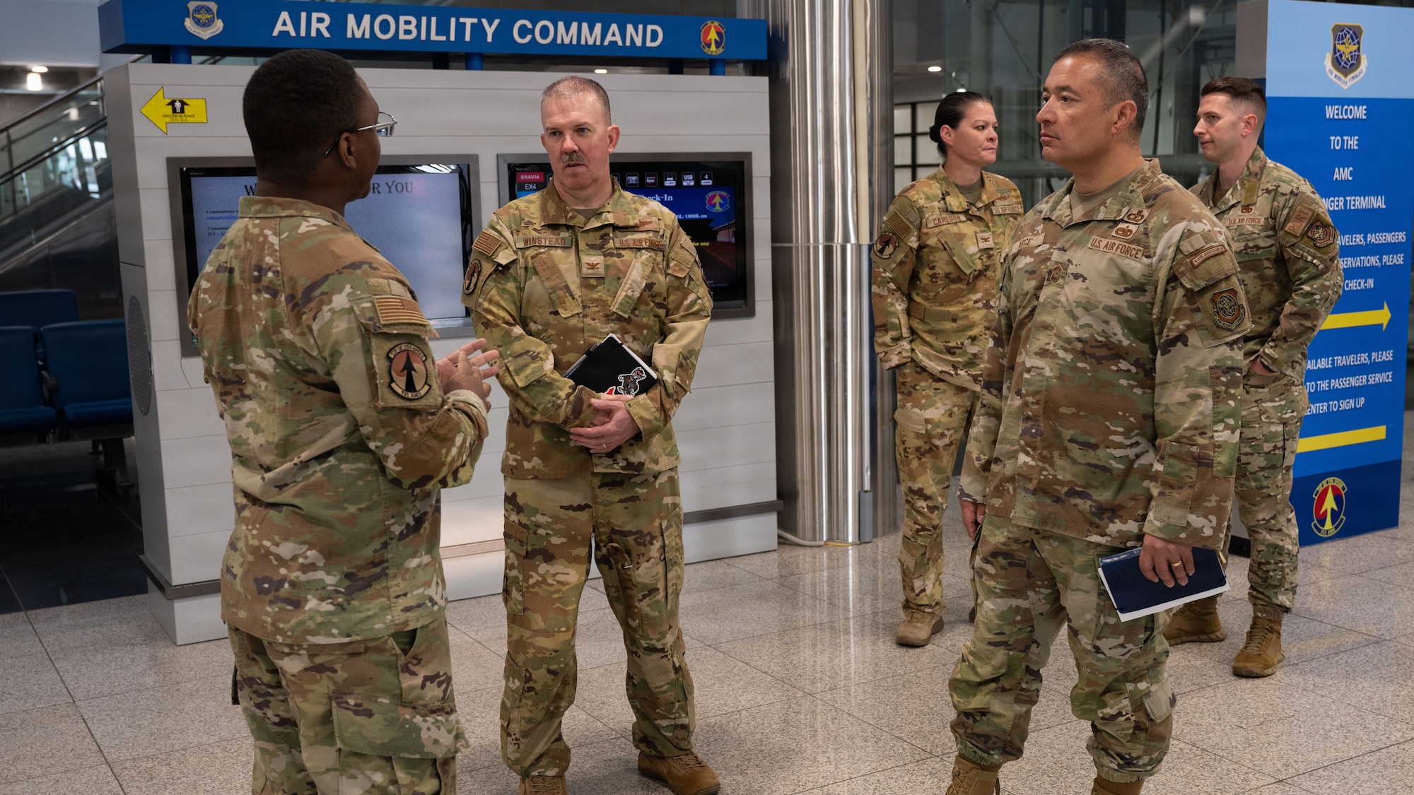 U.S. Air Force Col. Patrick Winstead, center, Eighteenth Air Force deputy commander, and Chief Master Sgt. Joseph Arce, right, 18th AF command chief, receives a brief from Staff Sgt. Rasheed Singleton, 731st Air Mobility Squadron passenger service supervisor, at Osan Air Base, Republic of Korea, April 1, 2026. Leadership engagements like this strengthen communication and ensure alignment across units supporting the mission at Osan. (U.S. Air Force photo by Senior Airman Rome Bowermaster)