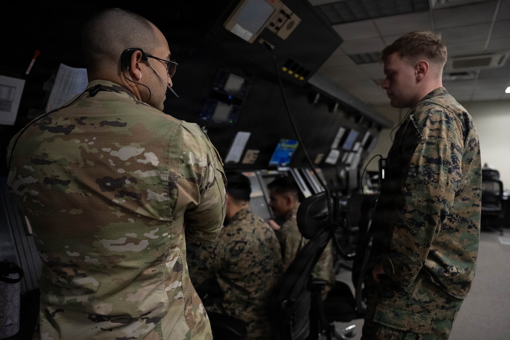 Service members conduct air traffic control operations.