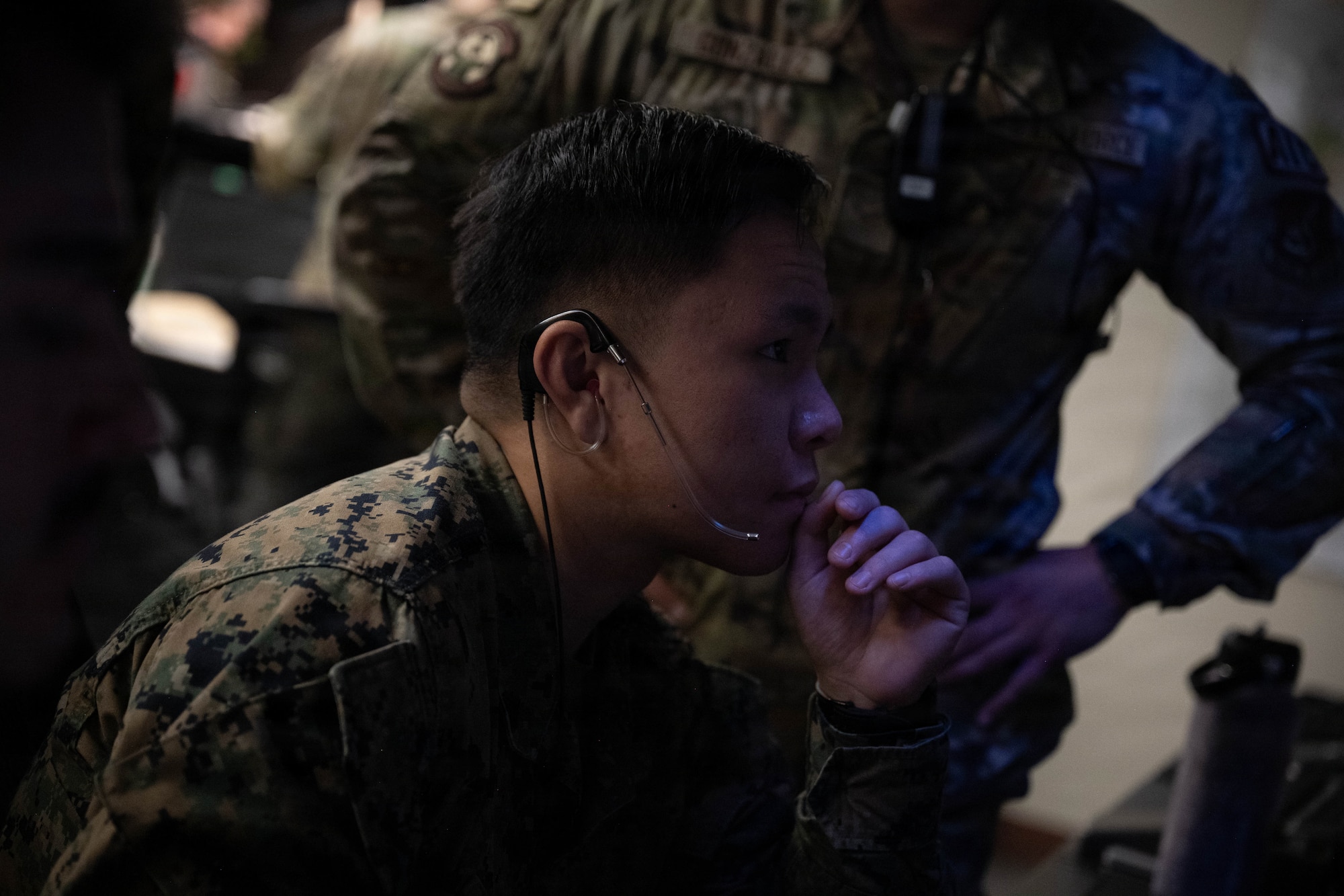 Marine conducts air traffic control operations.