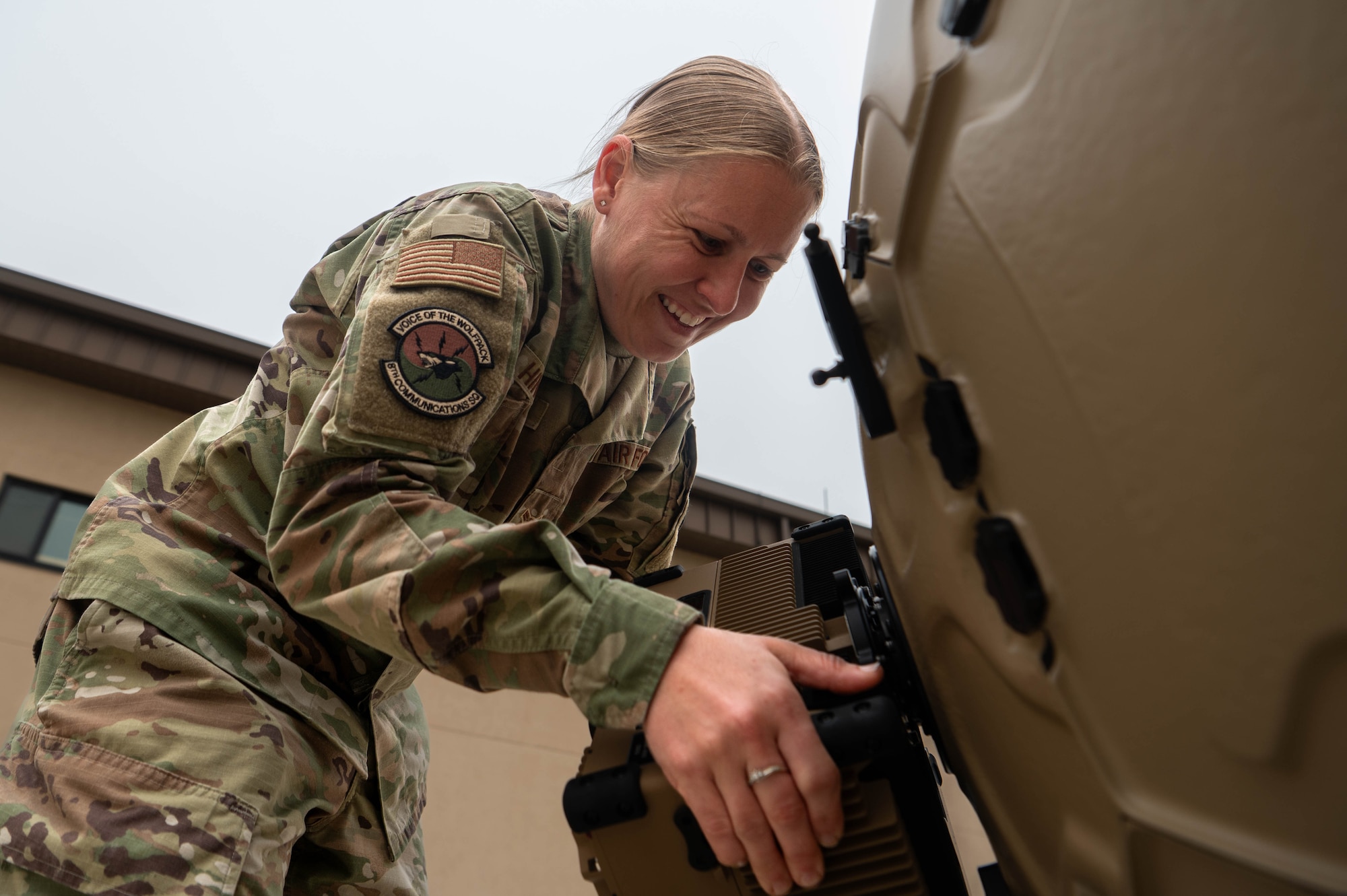 U.S. Air Force Airman 1st Class Allison Hinkle, 8th Communications Squadron radio technician, sets up a flyaway satellite communication terminal at Kunsan Air Base, Republic of Korea, April 1, 2026. Hinkle was selected as the Wolf Pack’s Pride of the Pack for the week of March 30-April 3 due to her achievements within her career field and her impact on the readiness and well-being of the Wolf Pack. (U.S. Air Force photo by Staff Sgt. Cedrique Oldaker)