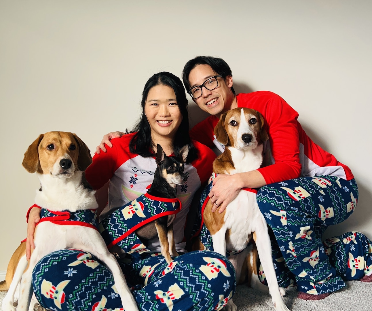Delia Chen, with her husband Chris and their three dogs (left to right – Sesame, Taco, Mei) at home during Christmas time in 2025.