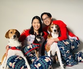 Delia Chen, with her husband Chris and their three dogs (left to right – Sesame, Taco, Mei) at home during Christmas time in 2025.