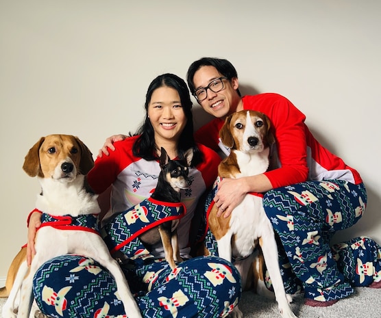 Delia Chen, with her husband Chris and their three dogs (left to right – Sesame, Taco, Mei) at home during Christmas time in 2025.
