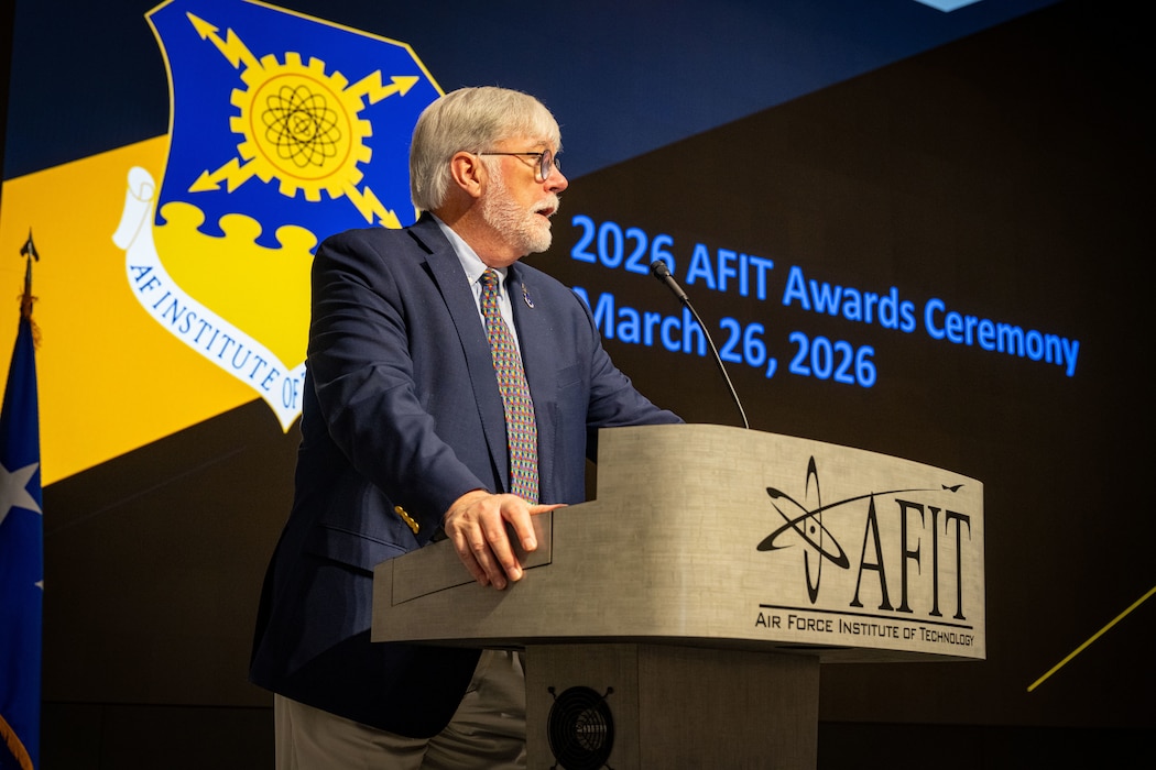 Dr. Walter F. Jones, director and chancellor of the Air Force Institute of Technology, congratulates students for their success and dedication to their studies in the Graduate School of Engineering and Management at Wright-Patterson Air Force Base, Ohio, March 26, 2026.  The graduating class included 181 students along with international partners from Australia, Saudi Arabia, Chile, Brazil and Israel.(U.S. Air Force photo by Jack Gardner)