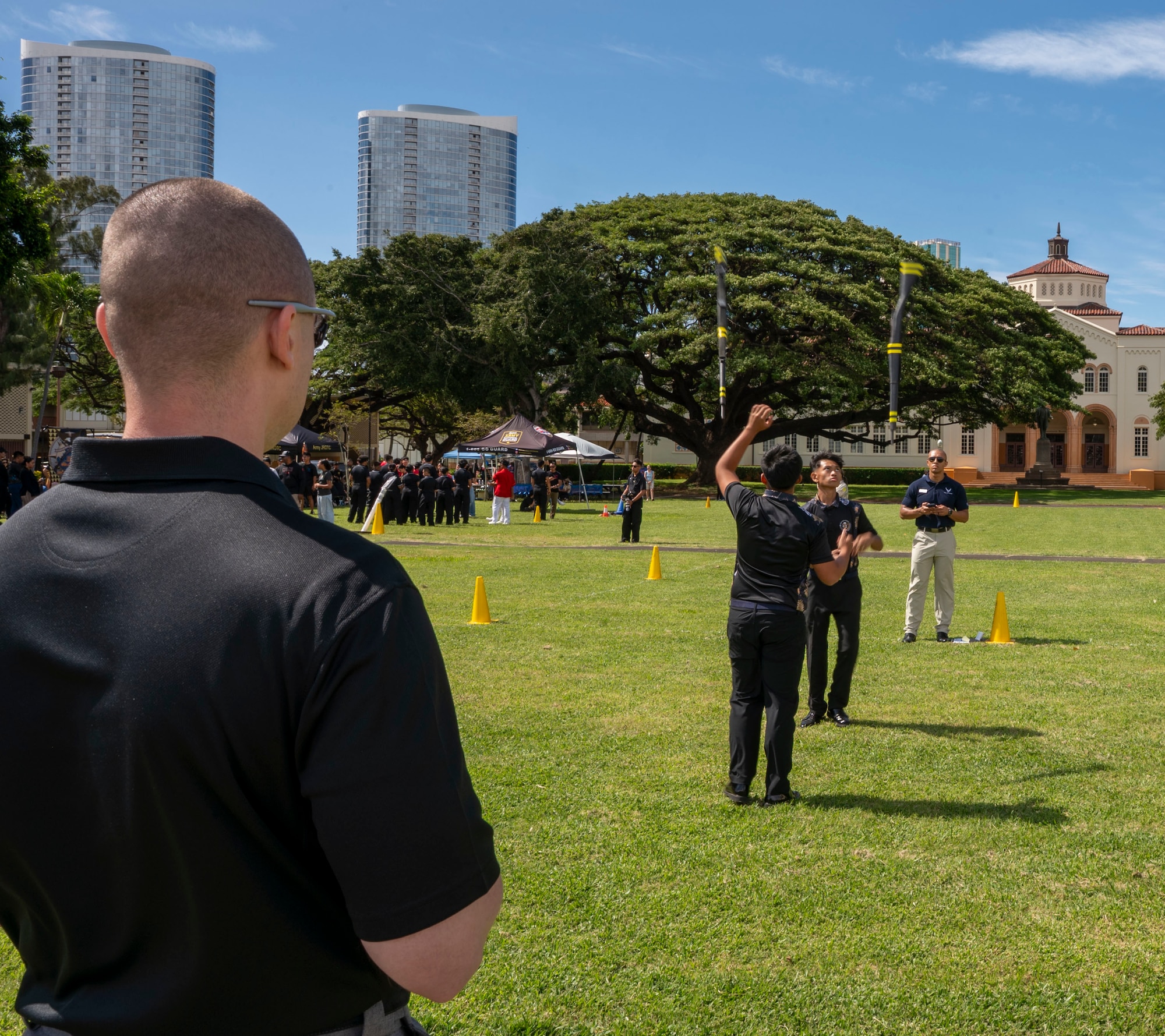 U.S. Air Force Staff Sgt. Joshua Alvord, technical training instructor with the U.S. Air Force Honor Guard, judges Junior ROTC cadets from Konawaena High School during the Pacific Regional Drill Meet in Honolulu, March 28, 2026. Cadets competed in the paired armed exhibition drill portion of the competition while the ceremonial guardsmen provided scores and feedback for more than 15 high school JROTC teams. (U.S. Air Force photo by Staff Sgt. Jordan Powell)