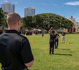 U.S. Air Force Staff Sgt. Joshua Alvord, technical training instructor with the U.S. Air Force Honor Guard, judges Junior ROTC cadets from Konawaena High School during the Pacific Regional Drill Meet in Honolulu, March 28, 2026. Cadets competed in the paired armed exhibition drill portion of the competition while the ceremonial guardsmen provided scores and feedback for more than 15 high school JROTC teams. (U.S. Air Force photo by Staff Sgt. Jordan Powell)
