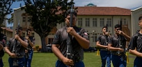 U.S. Marine Corps Junior ROTC cadets from Kapolei High School perform their armed team exhibition drill routine during the Pacific Regional Drill Meet in Honolulu, March 28, 2026. The team was evaluated and scored by members of the U.S. Air Force Honor Guard, who provided feedback following the performance. (U.S. Air Force photo by Staff Sgt. Jordan Powell)