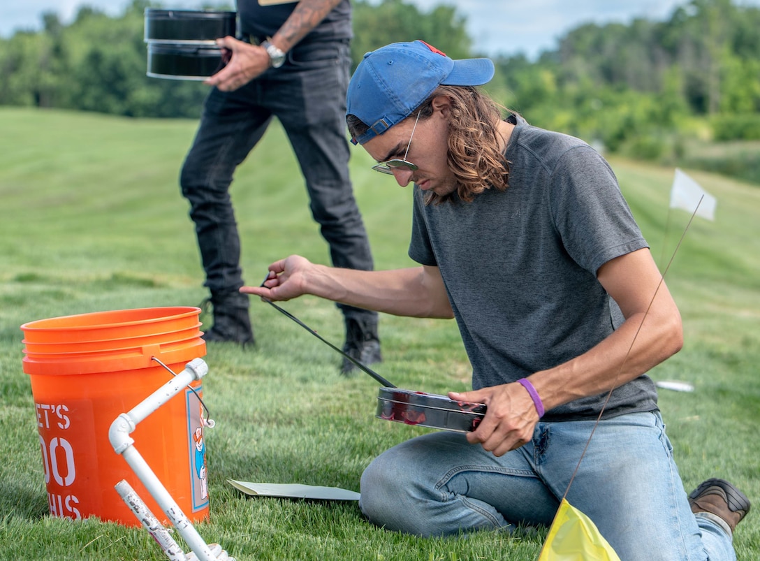 Health physicists conduct radon flux sampling at a FUSRAP site. (Courtesy photo)