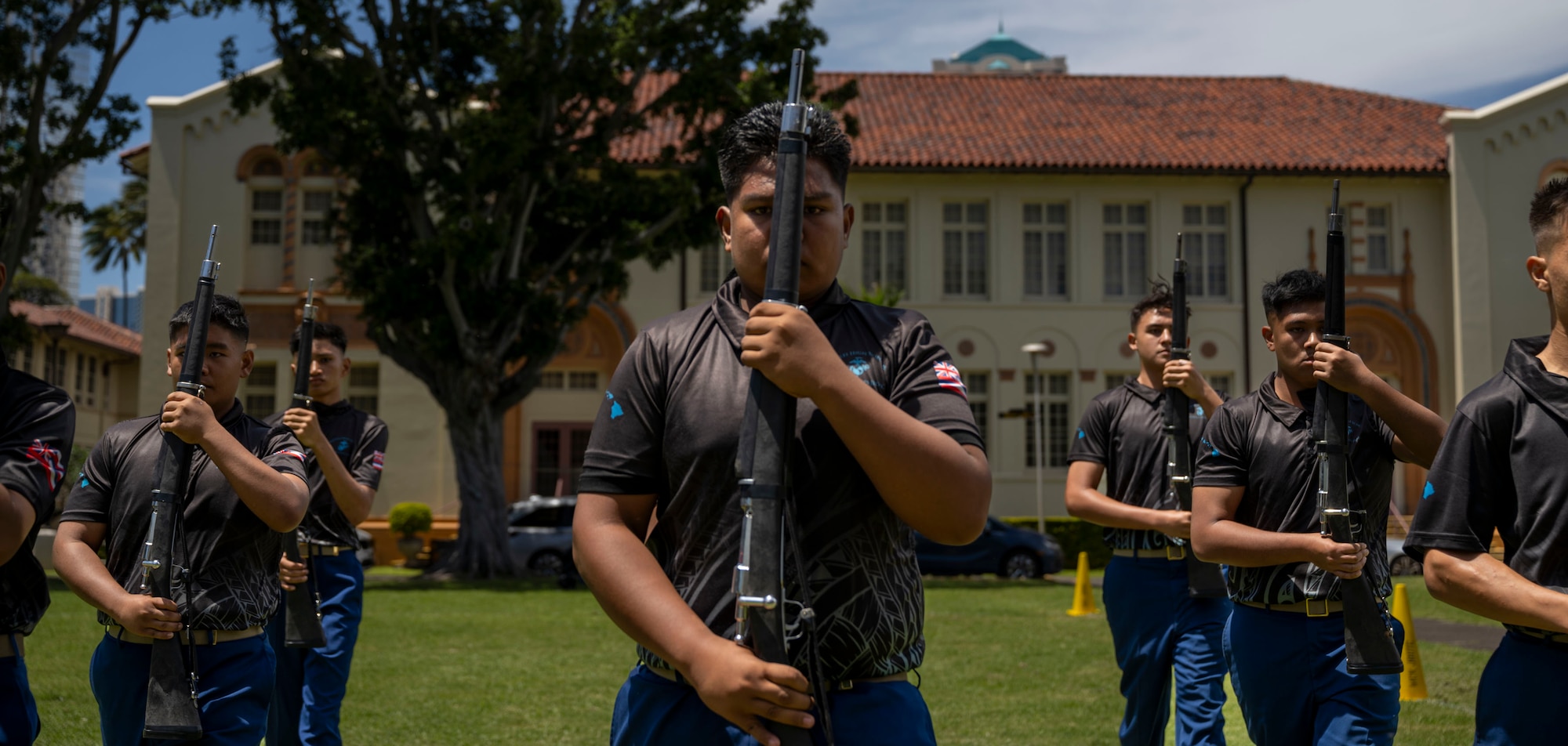 U.S. Marine Corps Junior ROTC cadets from Kapolei High School perform their armed team exhibition drill routine during the Pacific Regional Drill Meet in Honolulu, March 28, 2026. The team was evaluated and scored by members of the U.S. Air Force Honor Guard, who provided feedback following the performance. (U.S. Air Force photo by Staff Sgt. Jordan Powell)