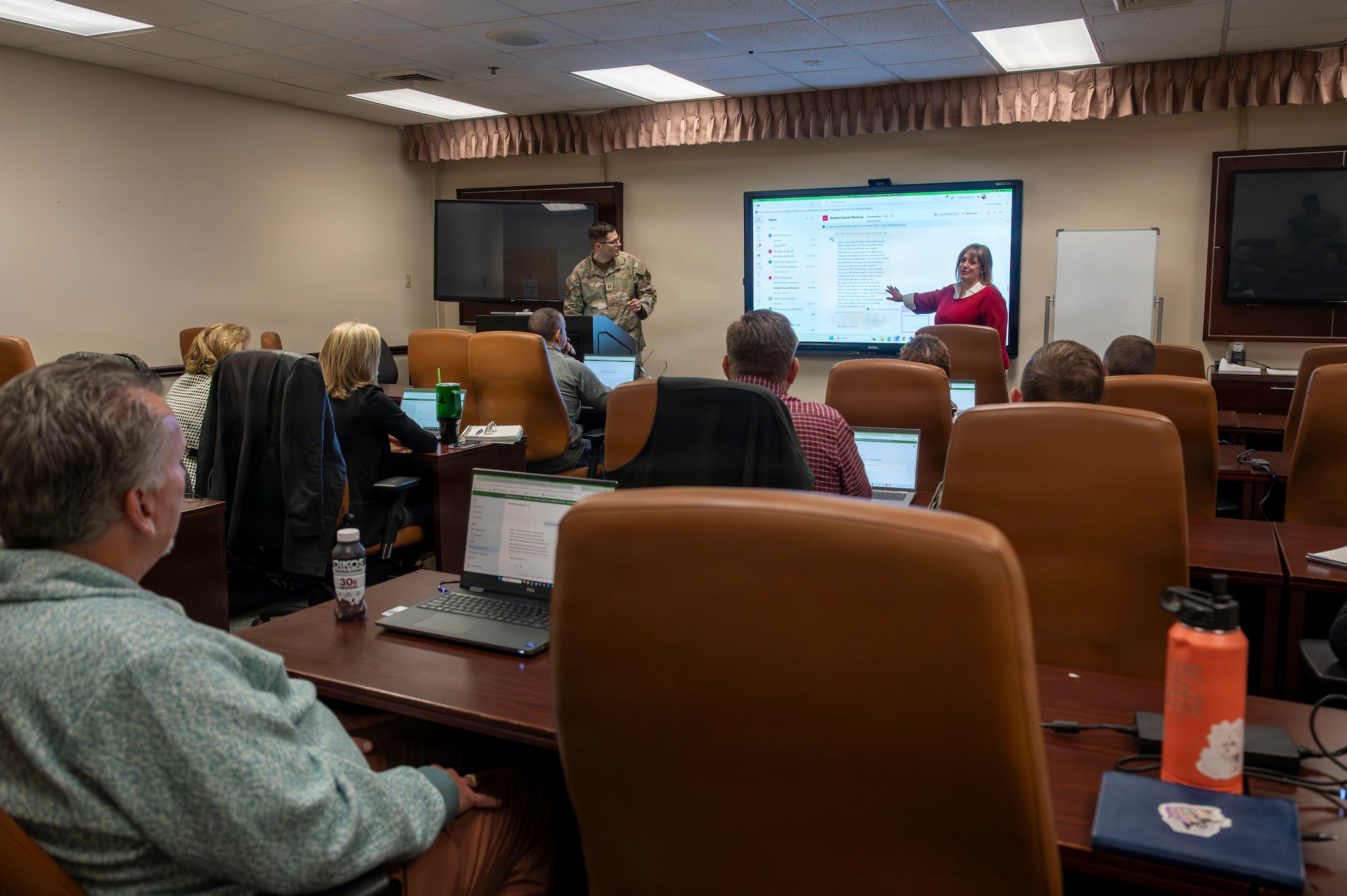 Participants discuss artificial intelligence uses during the AFSOC AI Bootcamp at Hurlburt Field.