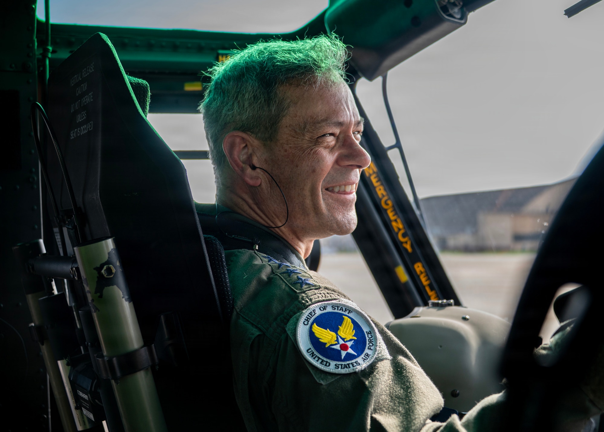 Air Force Chief of Staff Gen. Ken Wilsbach smiles after co-piloting a UH-1N Huey.