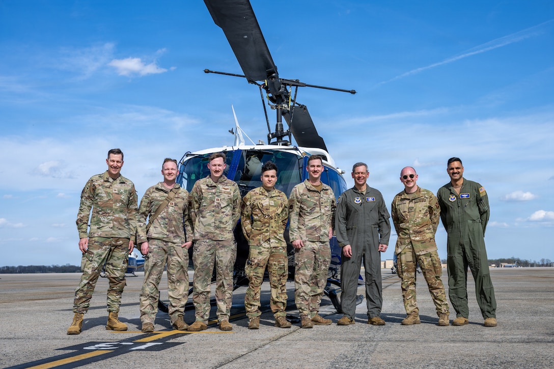 Air Force Chief of Staff Gen. Ken Wilsbach stands with a custom helmet from the 1st Helicopter Squadron.