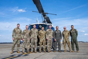 Air Force Chief of Staff Gen. Ken Wilsbach stands with a custom helmet from the 1st Helicopter Squadron.