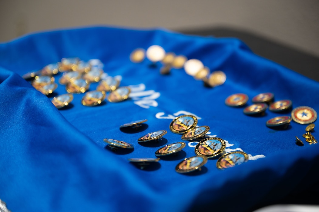Veterans' service badges lay before the ceremony, ready to be presented to Vietnam veterans.
