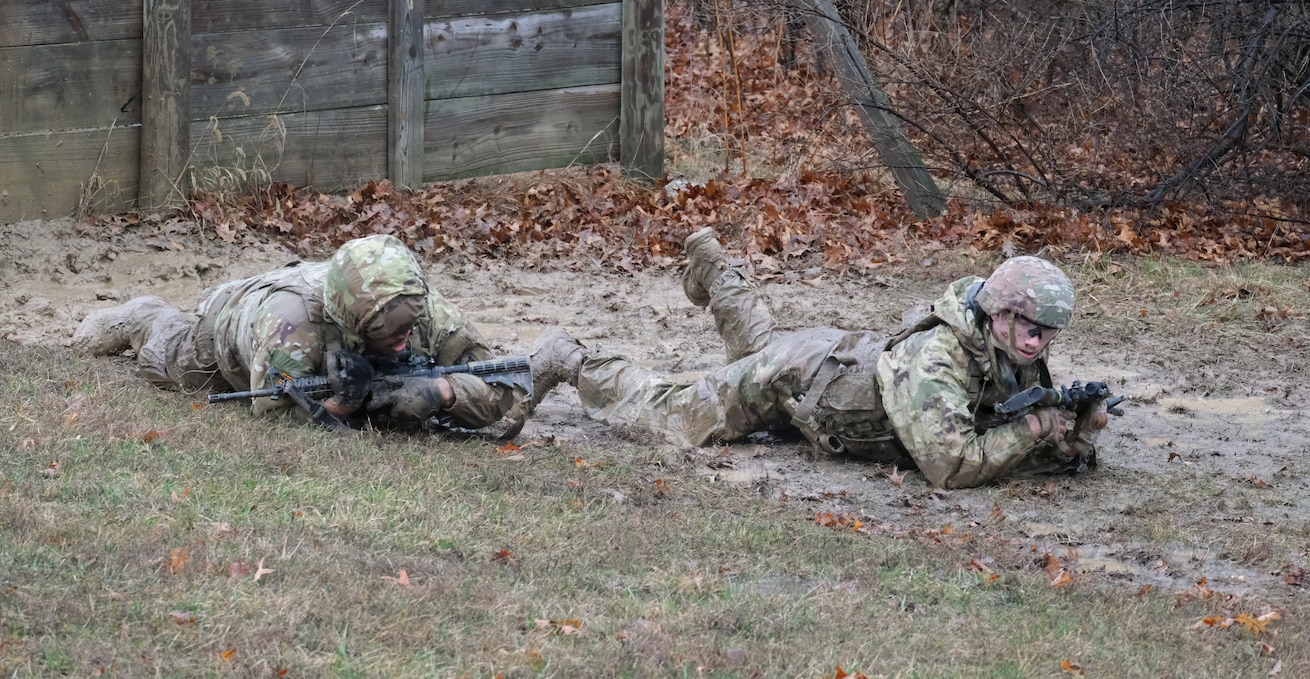 Illinois Army National Guard Soldiers high-crawl during the 233rd’s "Road to War" training at Marseilles Training Area