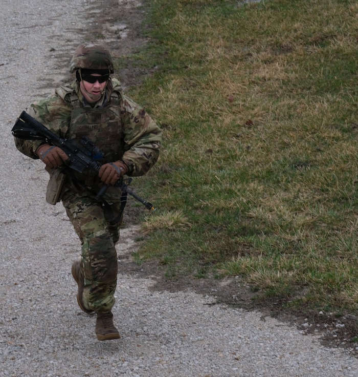 An Illinois Army National Guard Soldier runs toward an objective during the 233rd’s "Road to War" training at Marseilles Training Area