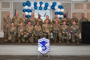 A group of airman pose for a photo