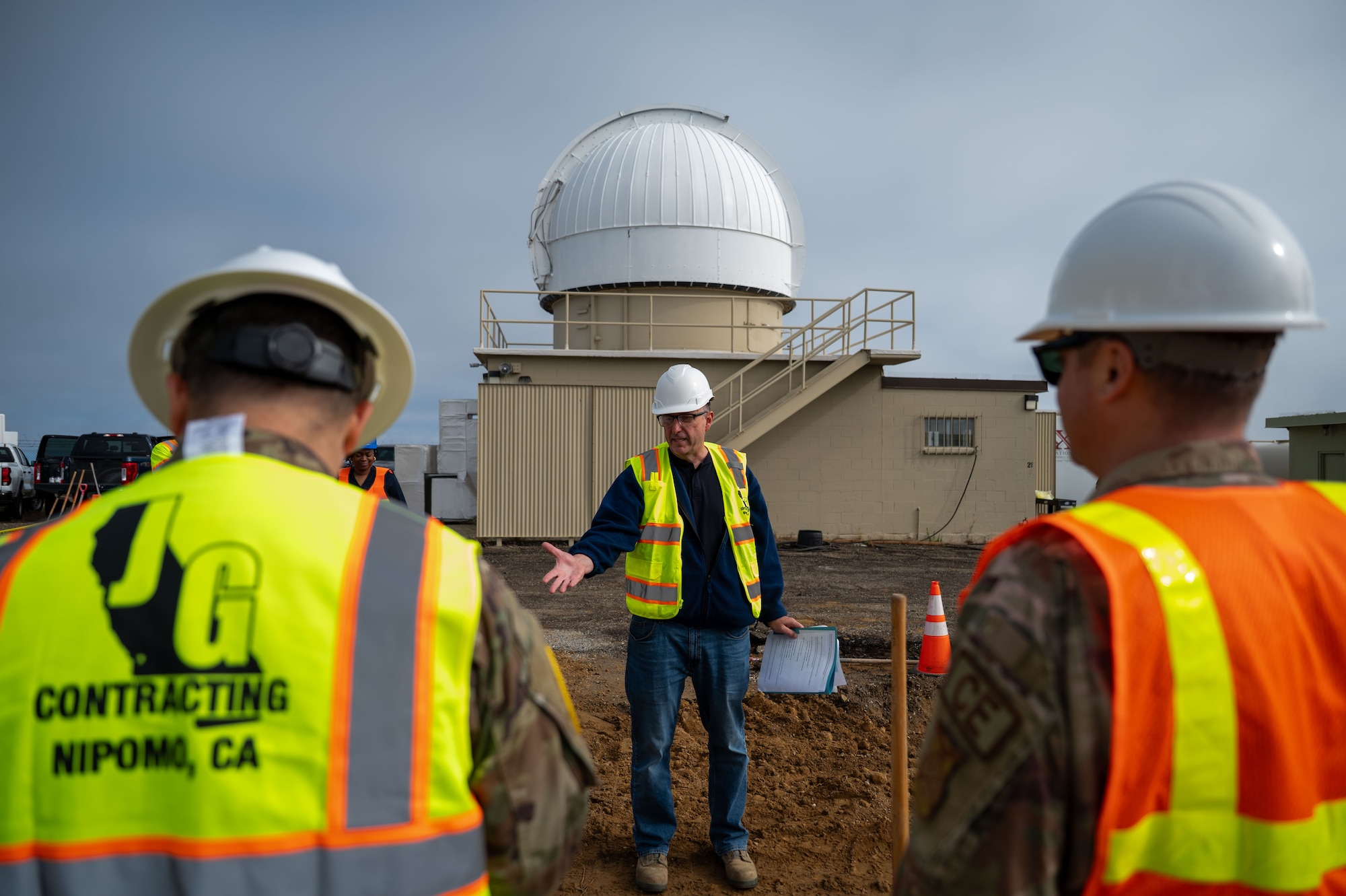 a person speaks to 2 others