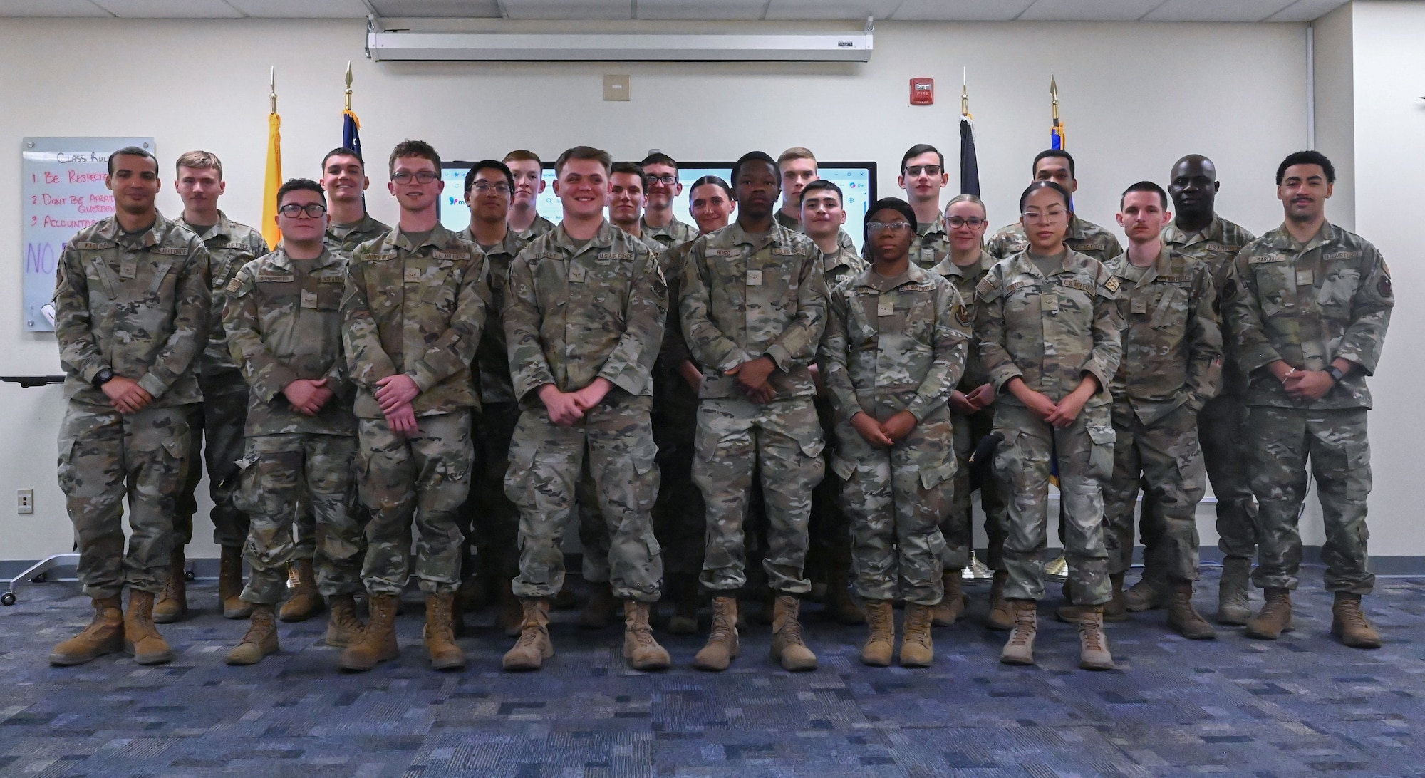 Airmen pose for a group photo after completing FTEC course.