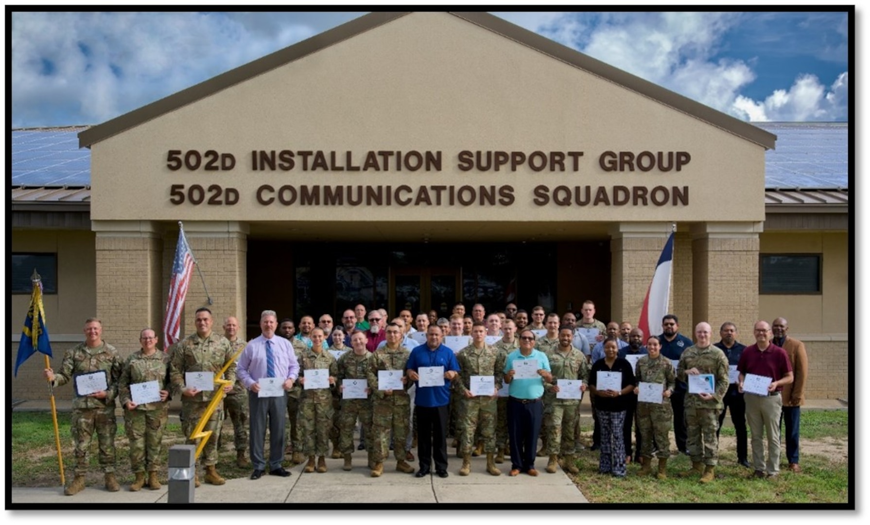 Seventy-four first-line supervisors assigned to 502d Communications Squadron, 502d Air Base Wing, Joint Base San Antonio-Lackland, Texas, pose for a group photo with their certificates of completion. The group completed the Continuous Improvement and Innovation (CI2) Green Belt Training together. (U.S. Air Force courtesy photo)