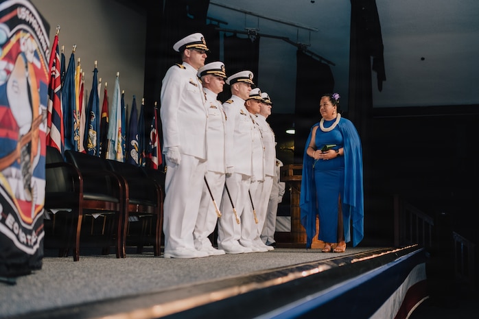JOINT BASE PEARL HARBOR-HICKAM, Hawaii (March 12, 2026) - Kumu Pualeilani Kamahoahoa, right, professional educator of Hawaiian culture, delivers blessings to the official party during the change of command ceremony for Virginia-class fast-attack submarine USS Hawaii (SSN 776), at Sharkey Theater on Joint Base Pearl Harbor-Hickam, Hawaii, March 12, 2026. Hawaii is assigned to Submarine Squadron 1 and is capable of supporting various missions, including anti-submarine warfare, anti-surface ship warfare, strike warfare, special operations forces support, and intelligence, surveillance, and reconnaissance. (U.S. Navy photo by Mass Communication Specialist 2nd Class Nicholas Russell)
