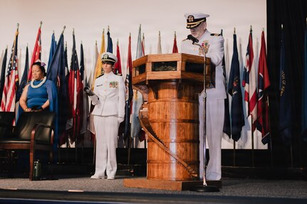 JOINT BASE PEARL HARBOR-HICKAM, Hawaii (March 12, 2026) – Cmdr. John Seers, Navy Chaplain, delivers the invocation during the change of command ceremony for Virginia-class fast-attack submarine USS Hawaii (SSN 776), at Sharkey Theater on Joint Base Pearl Harbor-Hickam, Hawaii, March 12, 2026. Hawaii is assigned to Submarine Squadron 1 and is capable of supporting various missions, including anti-submarine warfare, anti-surface ship warfare, strike warfare, special operations forces support, and intelligence, surveillance, and reconnaissance. (U.S. Navy photo by Mass Communication Specialist 2nd Class Nicholas Russell)