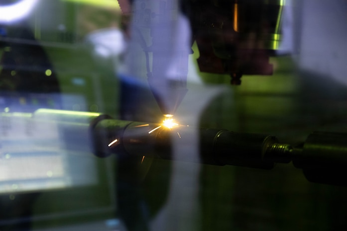 U.S. Army Chief Warrant Officer 5 Robert Henrikson, 2nd Infantry Division (2ID), Chief Warrant Officer 2 Eric Duddy, 194th Division Sustainment Battalion, and Maj. James Buensuceso, 2ID, are guided by South Korea Navy service members through a navy shipyard for close interaction with 3D printers used for their equipment, Changwon, South Korea, March 25, 2026.