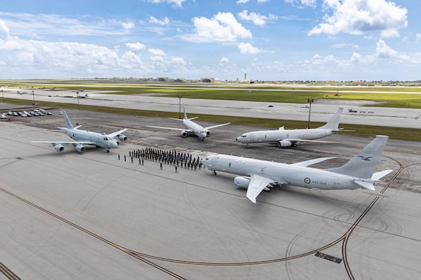 Sea Dragon anti-submarine warfare (ASW) competition participants pose for a group photo after the “Dragon Belt” was awarded to the Japan Maritime Self-Defense Force (JMSDF) for earning the highest average score all given ASW criteria at Andersen Air Force Base, Guam, March 18, 202