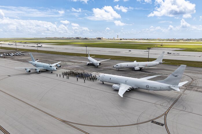 Sea Dragon anti-submarine warfare (ASW) competition participants pose for a group photo after the “Dragon Belt” was awarded to the Japan Maritime Self-Defense Force (JMSDF) for earning the highest average score all given ASW criteria at Andersen Air Force Base, Guam, March 18, 202