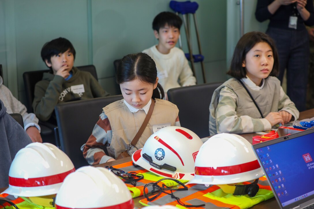Photos of USACE FED employees' kids attending "Bring Your Kid to Work Day."