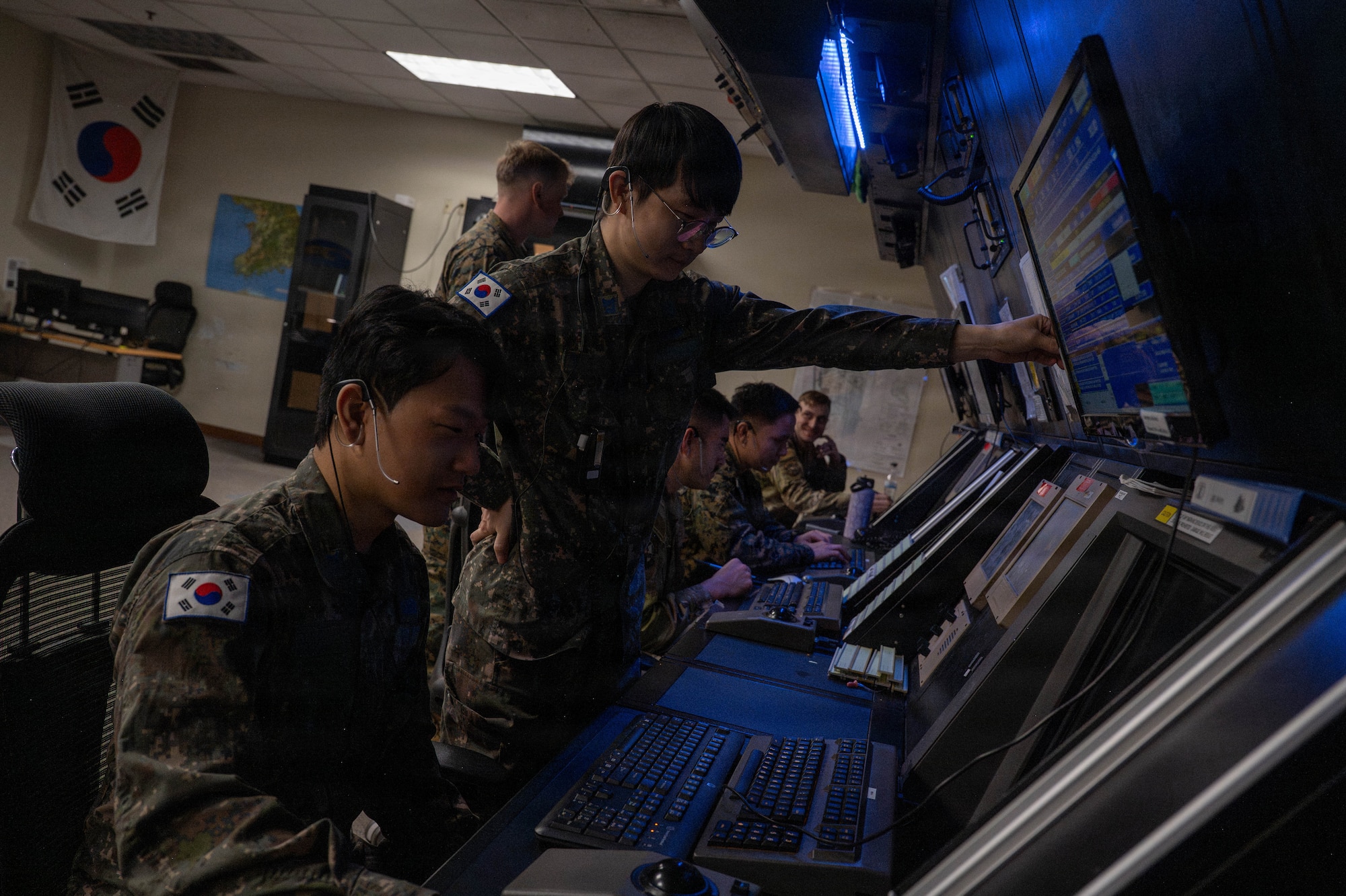 Service members from the Republic of Korea conduct air traffic control operations.