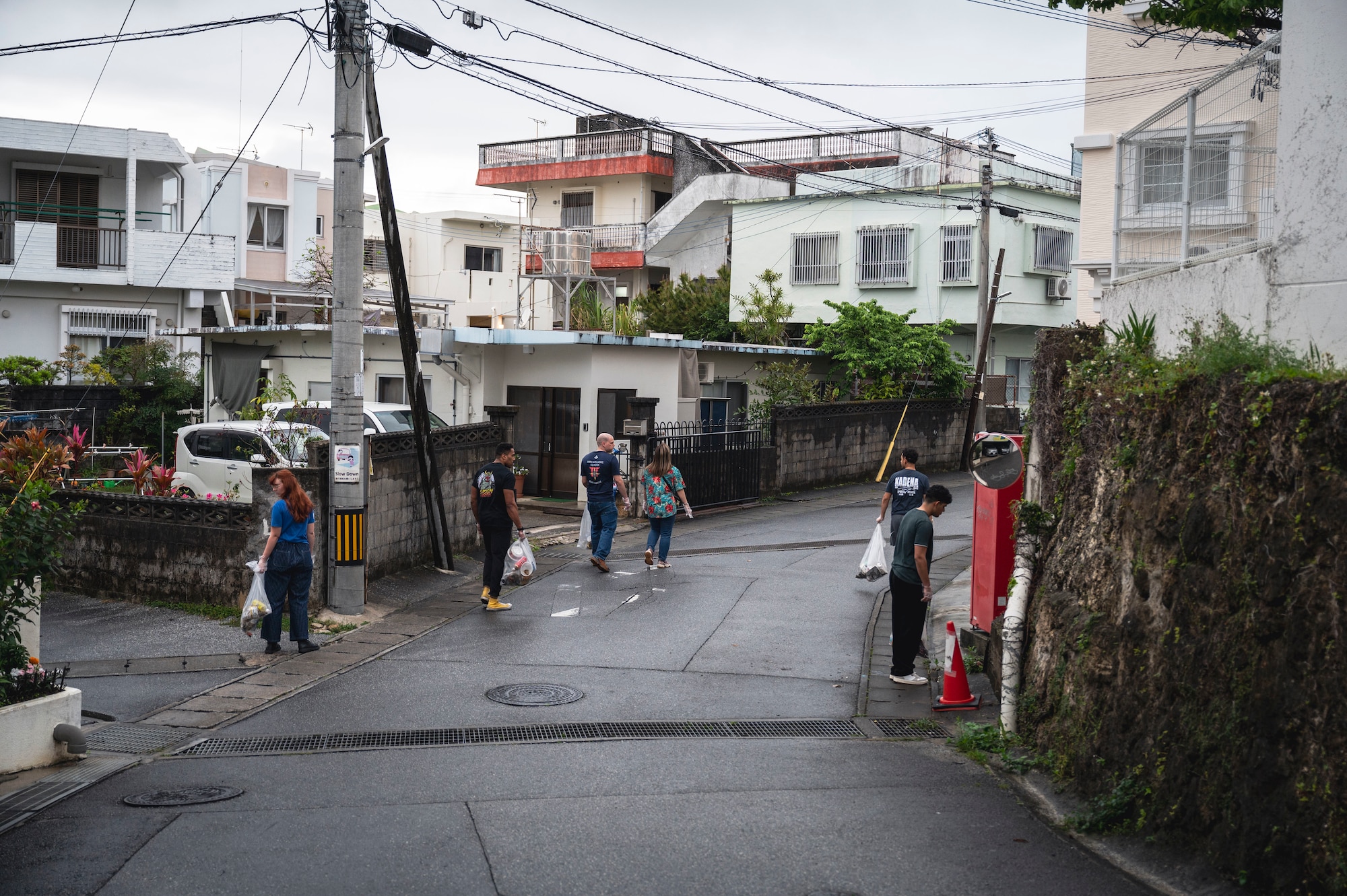 Members of the 18th Wing clean up a residential neighborhood in Chatan Town, Okinawa, Japan, April 1, 2026.