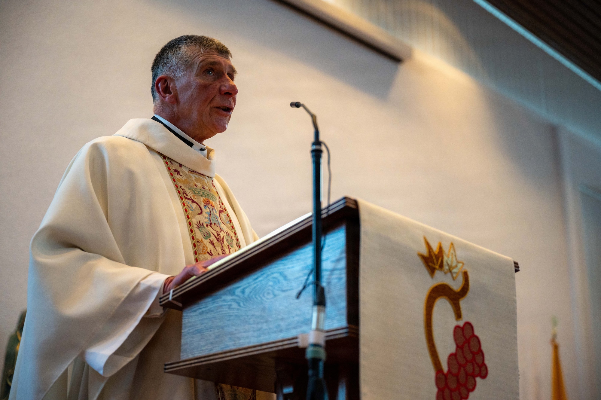 Rev. Joseph Deichert, priest, provides a sermon to the congregation during a Holy Thursday mass at the Northside Chapel on Ramstein Air Base, Germany, April 2, 2026.