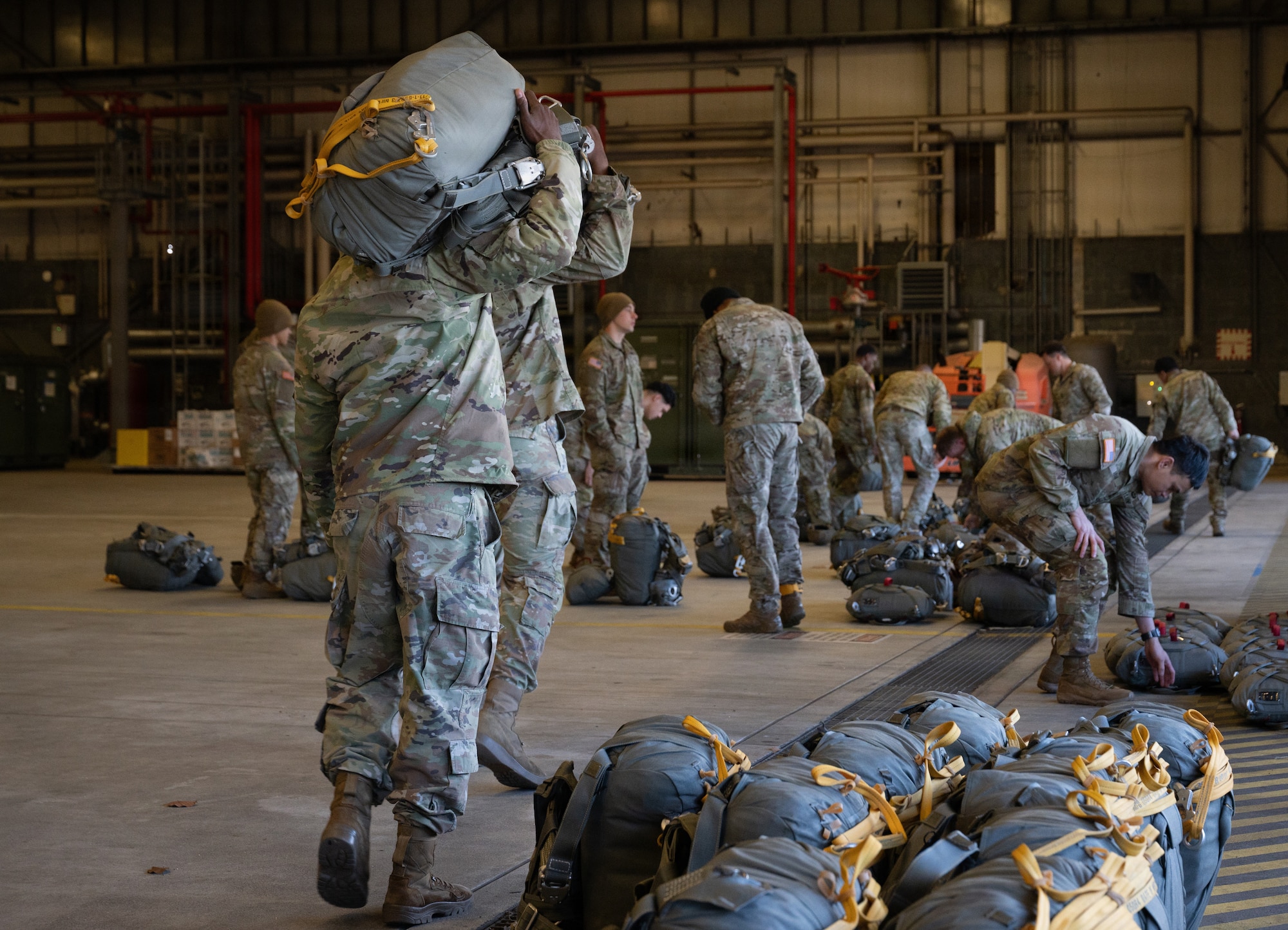 men prepare for parachute jump