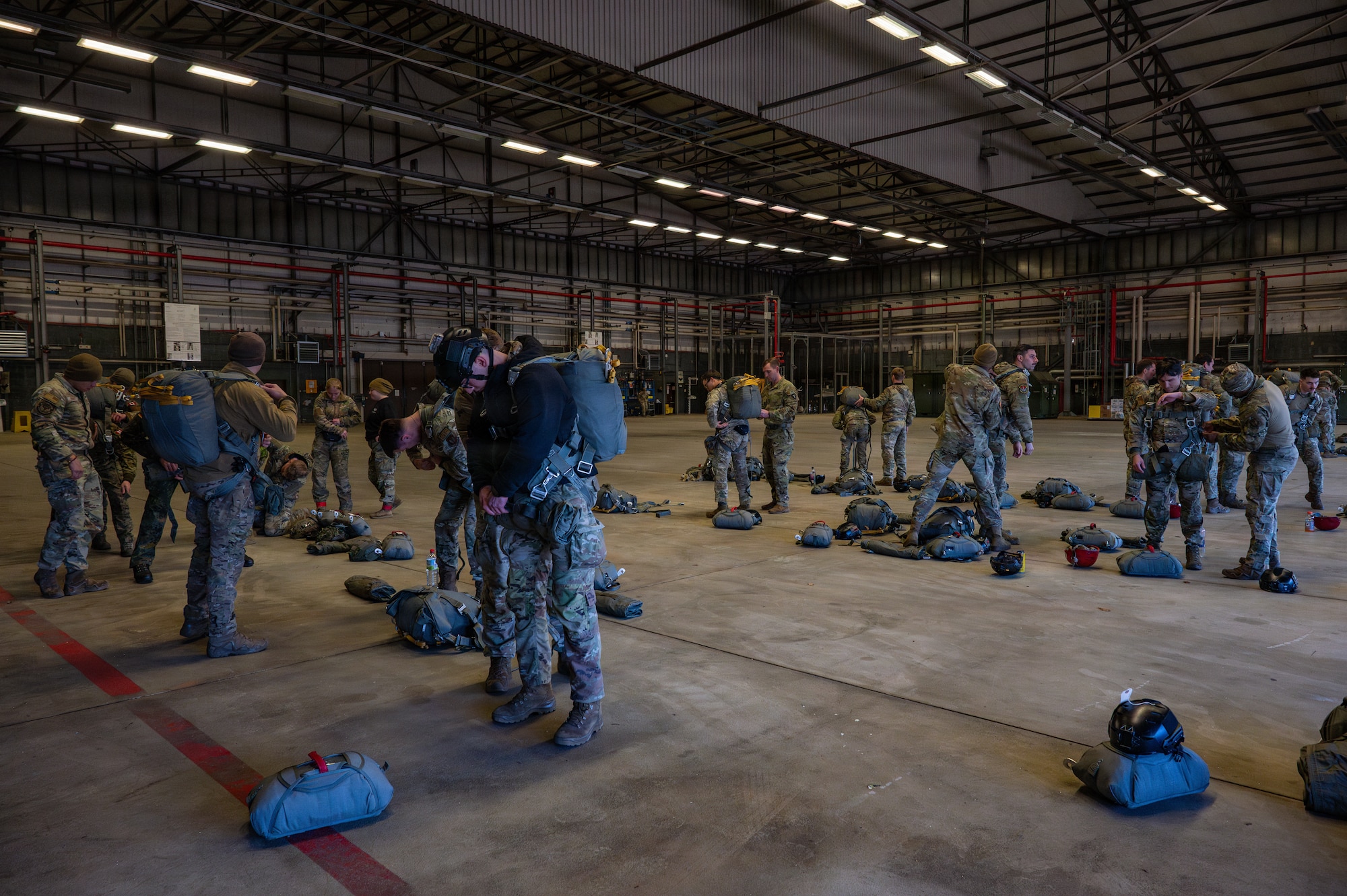Men prepare for a parachute jump