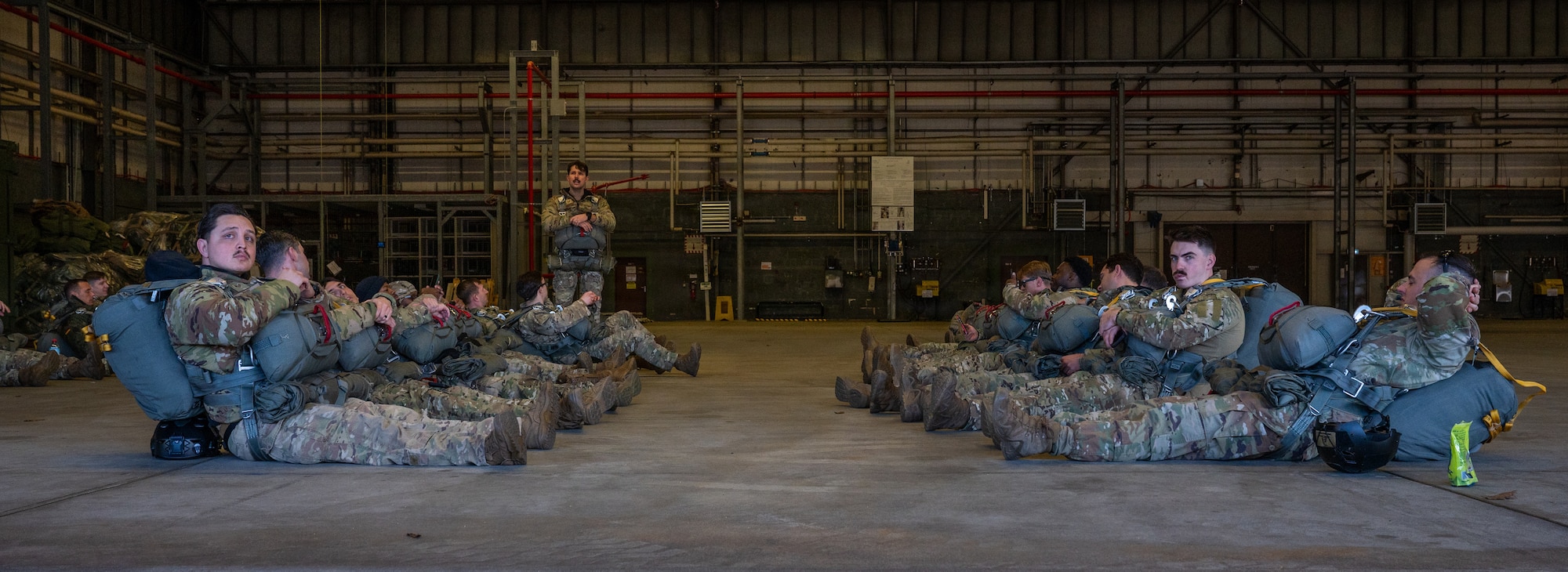 Men rest before parachute jump