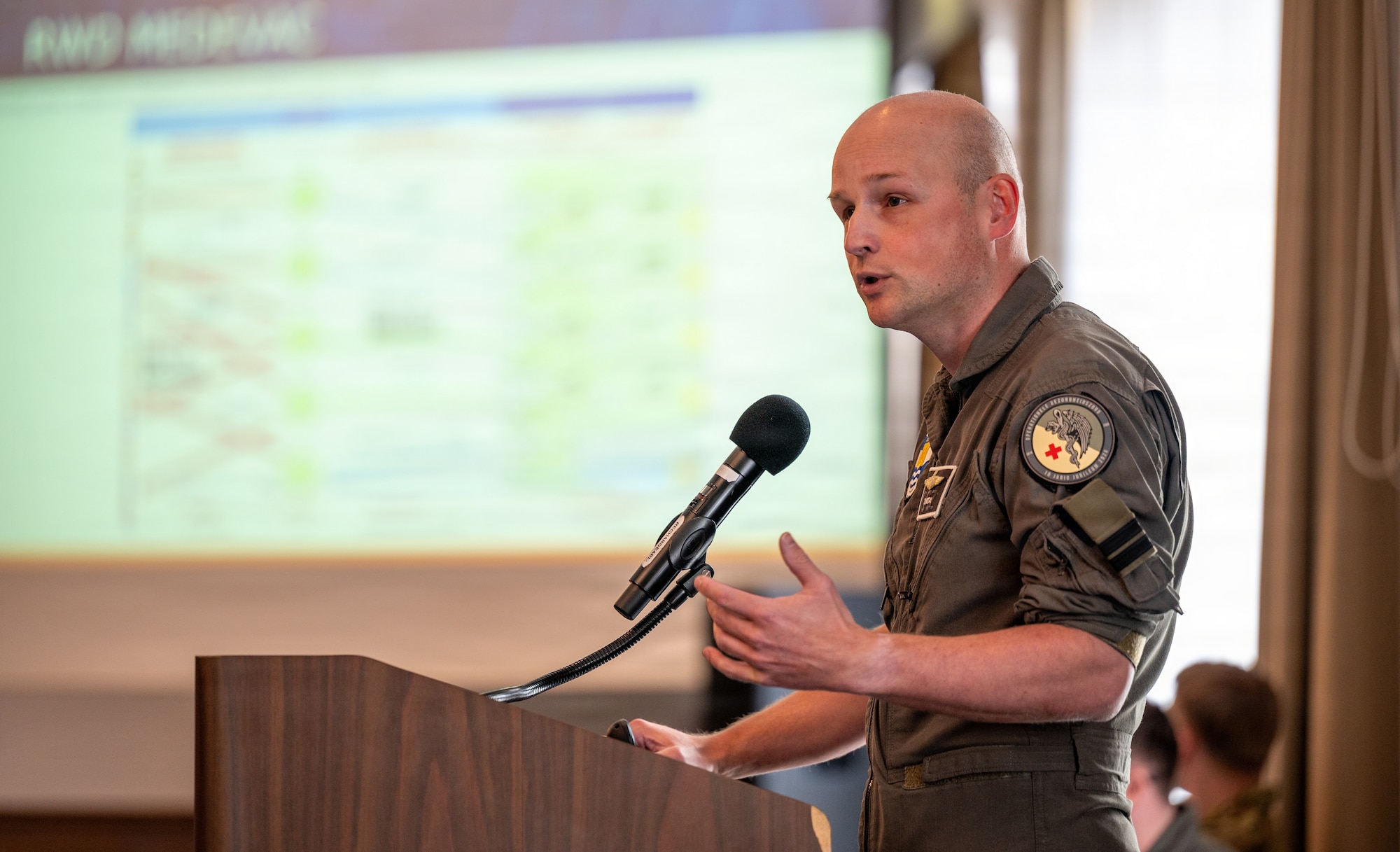 man speaks during conference