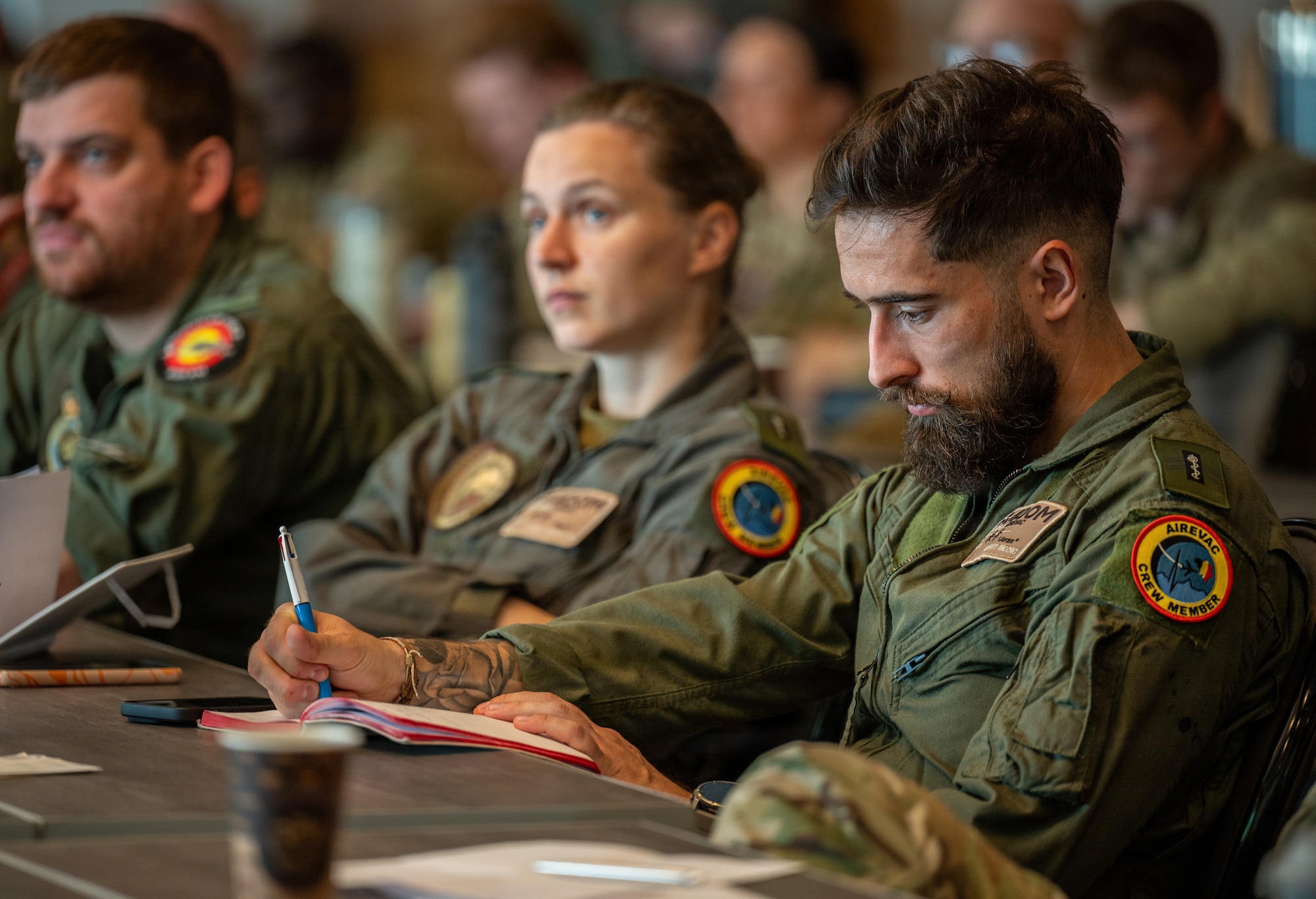 man listens during briefing