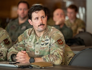 Man listens to briefing