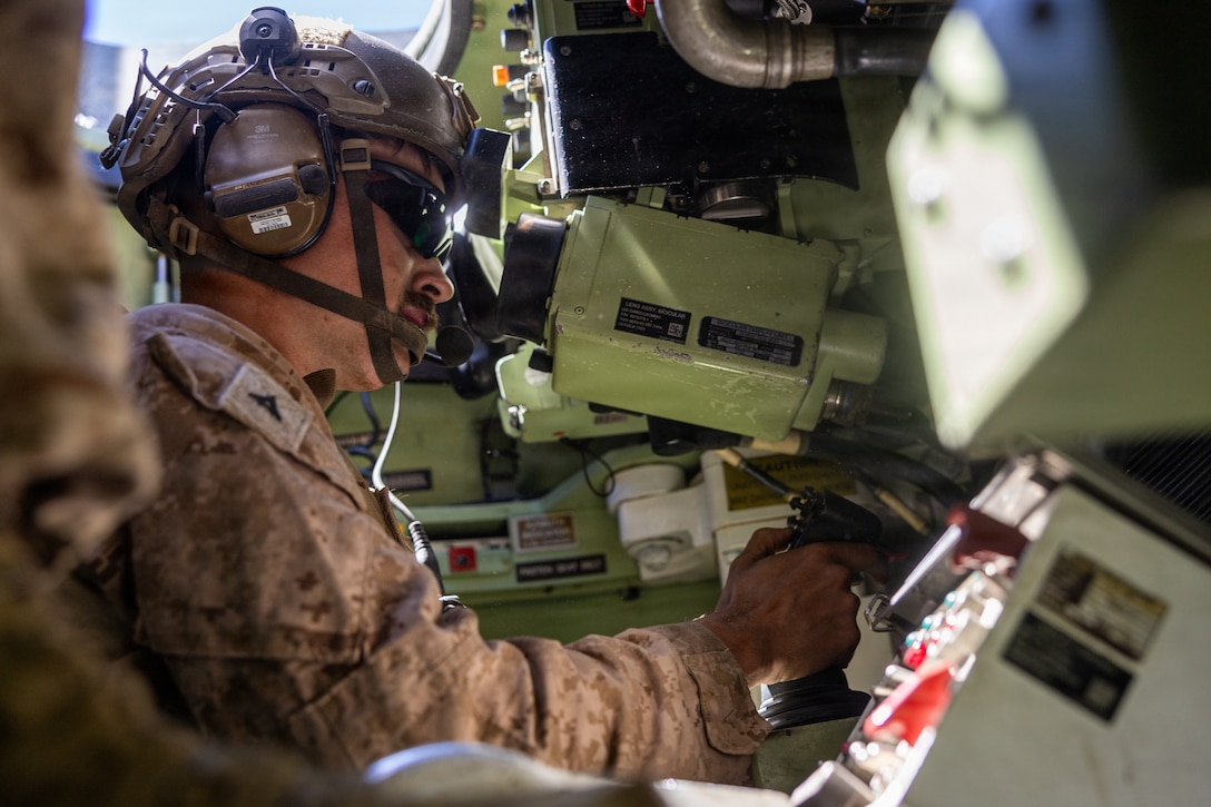 U.S. Marine Corps Lance Cpl. Alex Schmidt, a light armored reconnaissance Marine with 2d Light Armored Reconnaissance Battalion, 2d Marine Division, fires out of a light armored vehicle for the light armored vehicle live-fire range event during the 2026 Bushmaster Competition, Camp Pendleton, California, March 27, 2026. This year, hosted by 4th Light Armored Reconnaissance, 4th Marine Division, the friendly competition gathers Light Armored Vehicle crews from across the U.S. Marine Corps, Australia and New Zealand to test their tactical and technical skills. (U.S. Marine Corps photo by Sgt. Aaron TorresLemus)