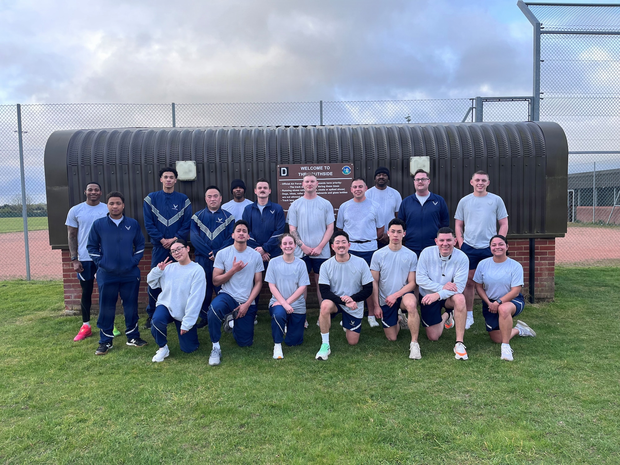 U.S. Airmen assigned to the 100th Comptroller Squadron pose for a photo after completing an early-morning physical training session at RAF Mildenhall, England, April 2, 2026.