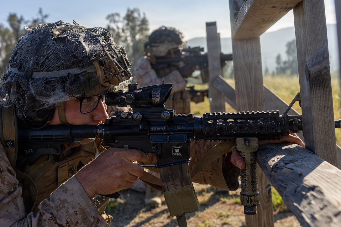 U.S. Marine Corps Sgt. Ian Shapiro, a light armored vehicle crewman with 4th Light Armored Reconnaissance, 4th Marine Division, aims down range before shooting down range during the rifle skill range portion event during the 2026 Bushmaster Competition, Camp Pendleton, California, March 25, 2026. This year, hosted by 4th Light Armored Reconnaissance, 4th Marine Division, the friendly competition gathers Light Armored Vehicle crews from across the U.S. Marine Corps, Australia and New Zealand to test their tactical and technical skills. (U.S. Marine Corps photo by Sgt. Aaron TorresLemus)